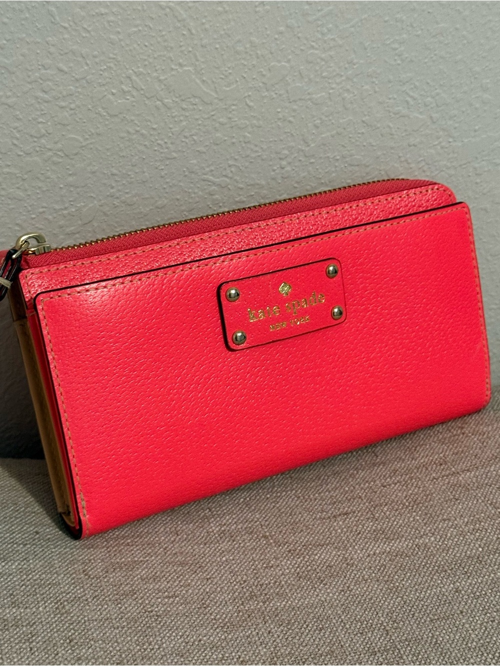 kate spade Bright Coral Pink Pebbled Leather Zip Wallet